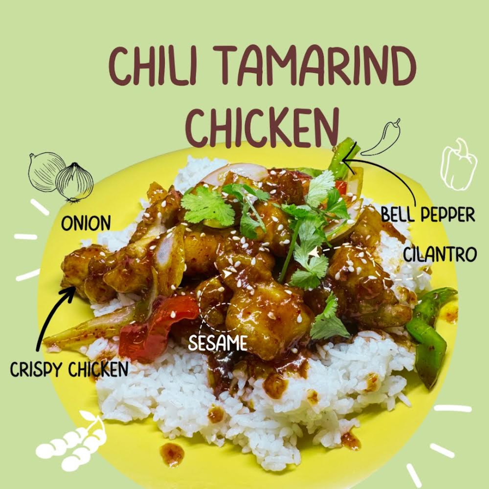 Chili Tamarind Chicken from Tasty Thai Campus, with crispy chicken, onions, bell peppers, cilantro, and sesame.